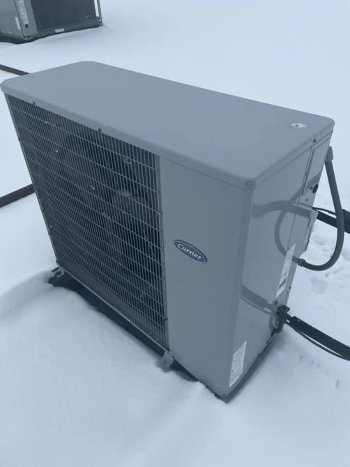 Carrier condenser unit installed on a rooftop in winter, Chartiers Mechanical job site